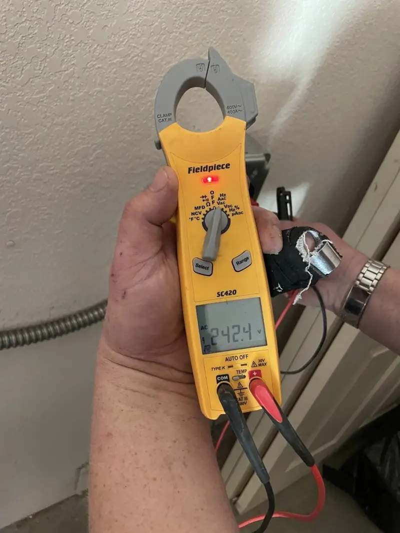 Voltage testing with clamp meter during Recessed Lighting Installation in Nicholasville